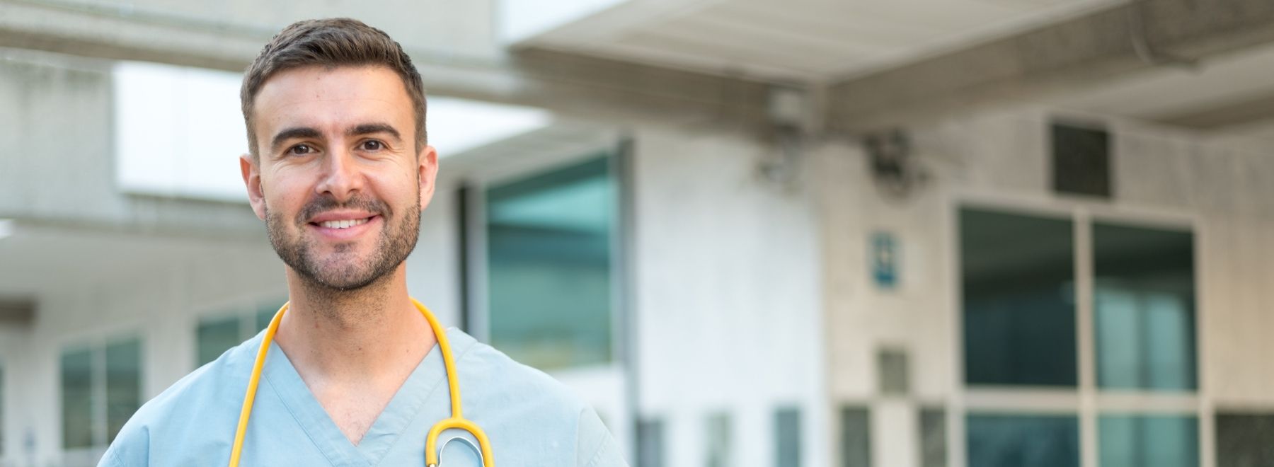 A smiling male nurse